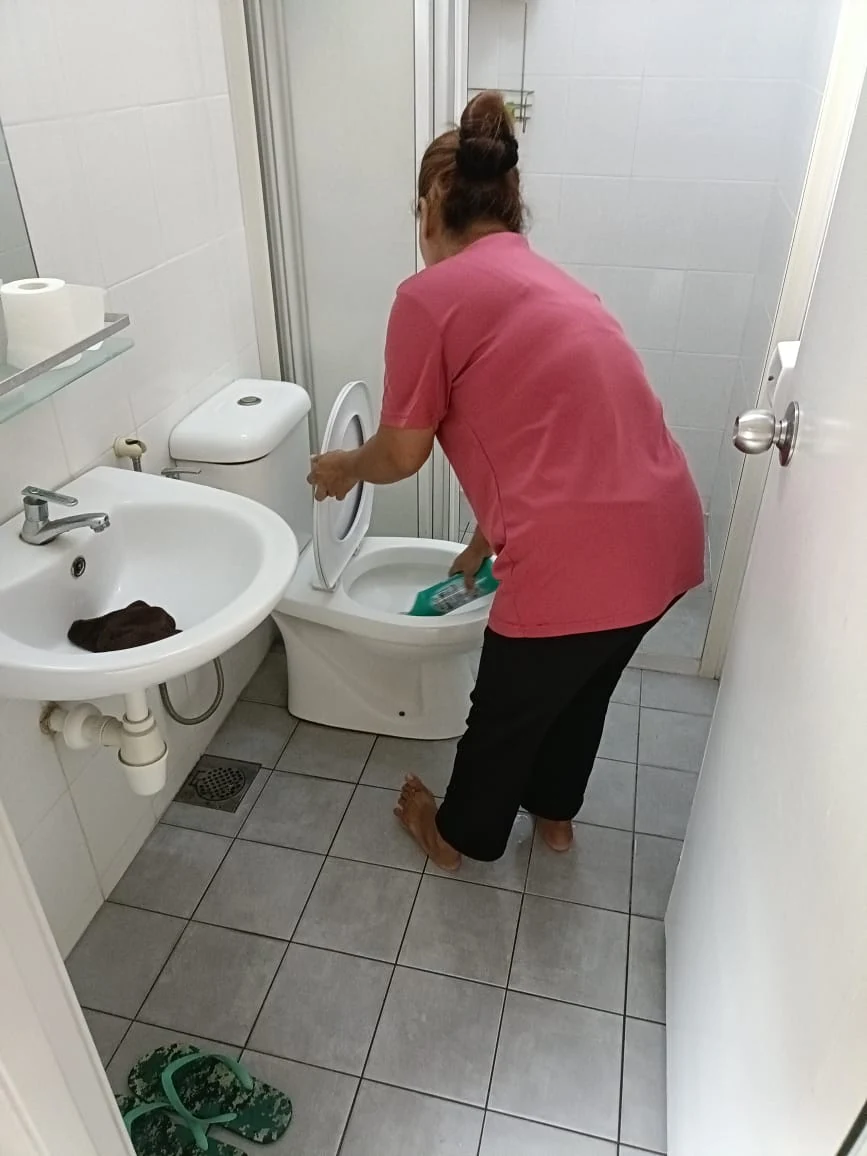 myKiwi team member cleaning the centre washroom