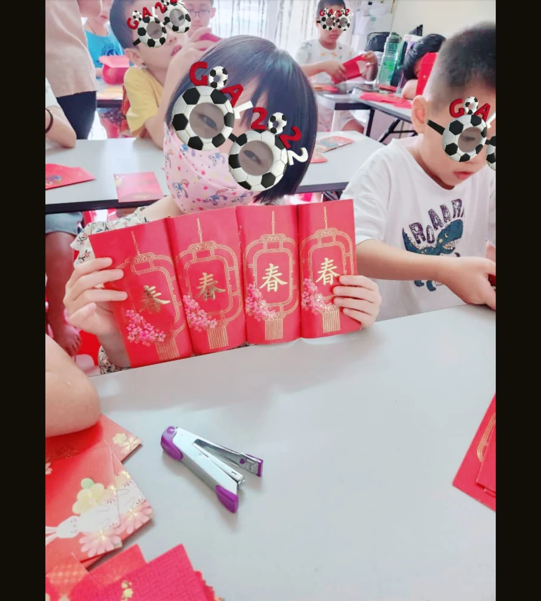 Children making red-packet crafts at myKiwi in Kajang