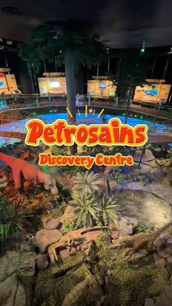 Dinosaur and rainforest exhibit with the Petrosains Discovery Centre name