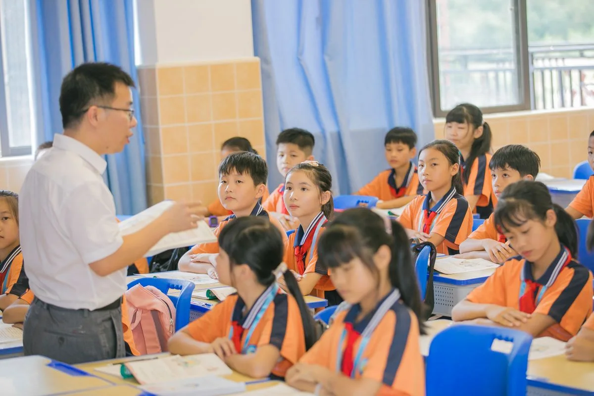 Teacher and pupils during a classroom lesson